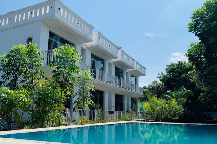 Nighttime view of sparkling hotel pool with ambient lighting